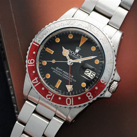 rolex gmt-master ref. 16750.|Rolex 16750 on brown strap.